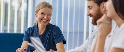 Nurse laughing with patient