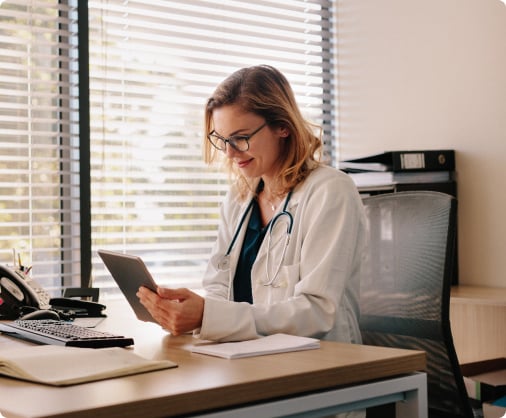 doctor reading a tablet